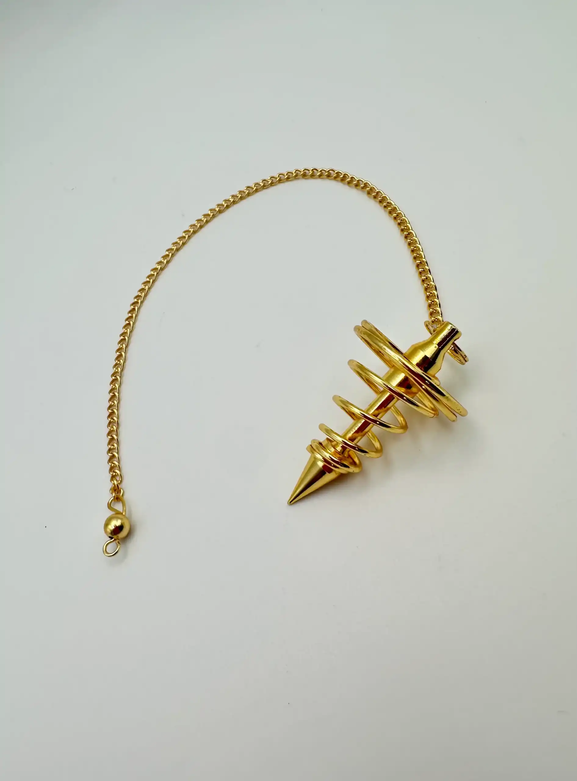 Péndulo Espiral Dorado
